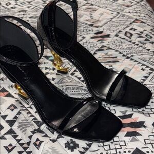 Elegant Black Heels with Gold Accents